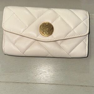 Vince Camuto Quilted Cream Wristlet with Gold Medallion
